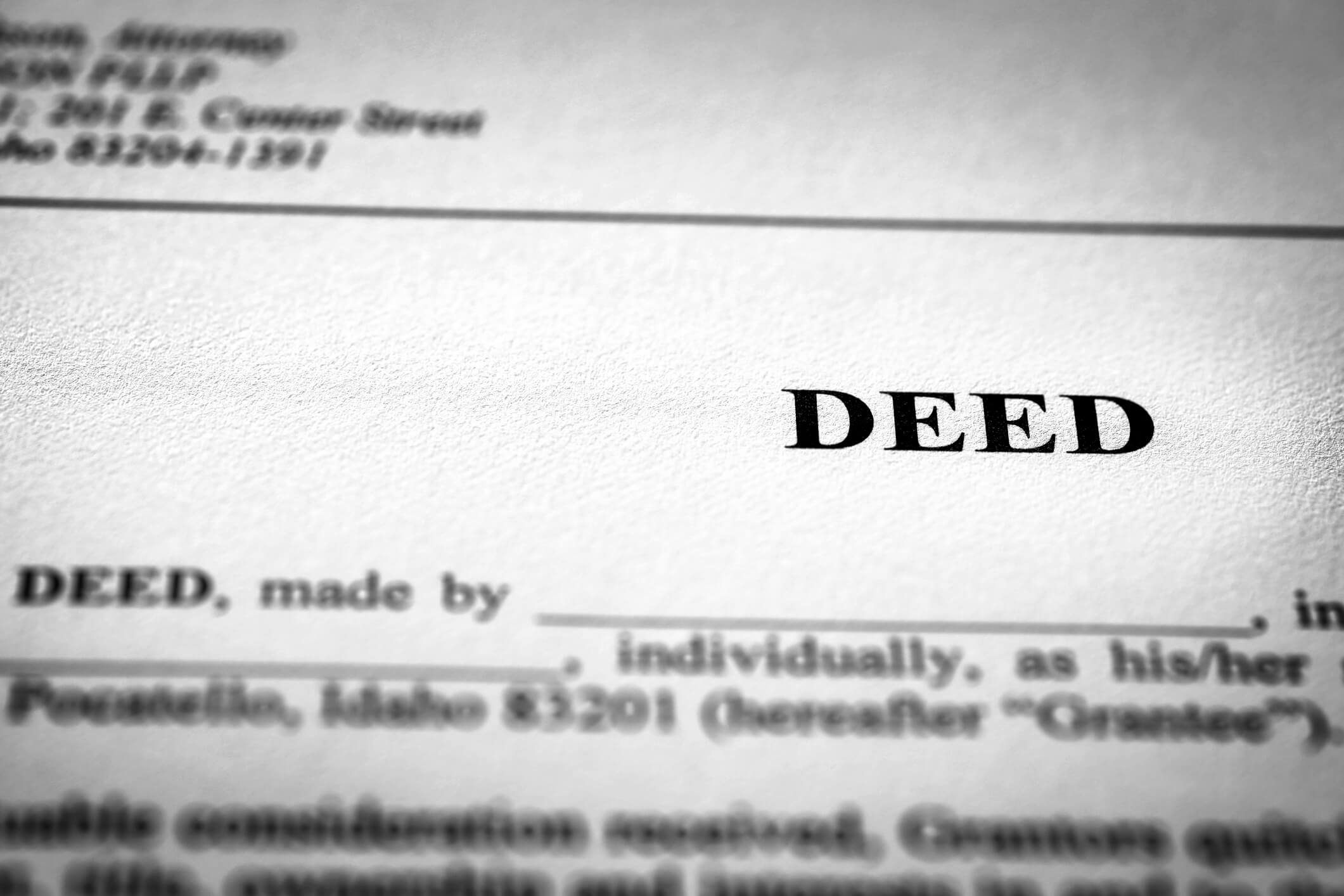Deed to real estate transfer title ownership to land or home